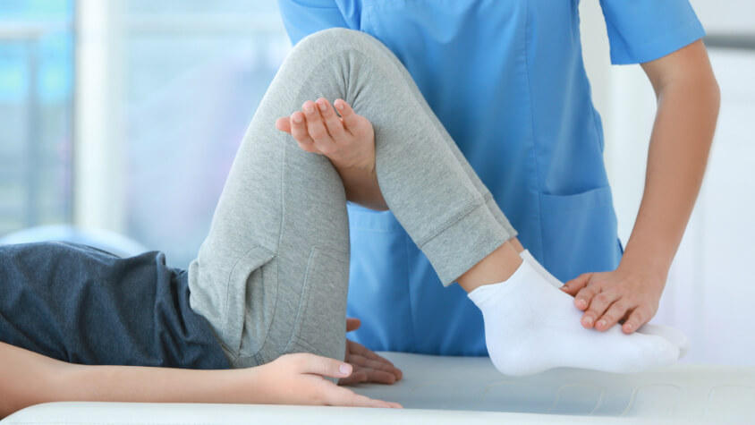 A person bends their knee