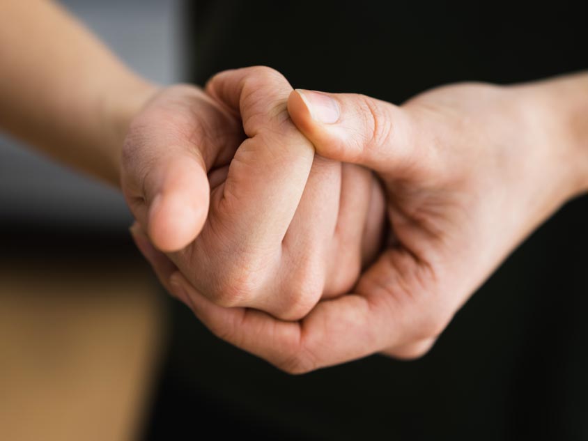 A person cracking their knuckles